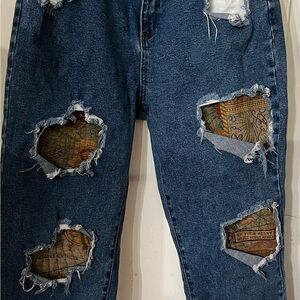 Upcycled Fashion Nova Distressed Blue Jeans with holes. Some are patched.